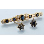 A sapphire and diamond brooch,