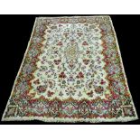 A Kerman carpet, with floral design to European taste on ivory ground, 314 x 213cms (123 1/2 x 84in.