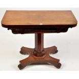 An early 19th Century mahogany swivel top card table,