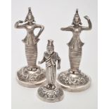 Two Indian white metal female deity figures, standing on scrolling domed bases, 3 1/2in.