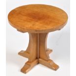 Malcom "Foxman" Pipes: an oak occasional table, the circular top with adzed design,