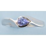 A tanzanite ring, the pear cut tanzanite within crossover mount, on 9ct.