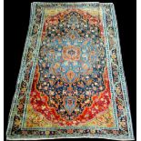 A Farahan rug, with full floral decoration, 222 x 127cms (87 1/2 x 50in.).