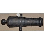 A cast iron black painted deck cannon, 50cms (19 1/2in.) long.