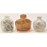 Three inside painted glass snuff bottles, with buildings within wooded landscape,