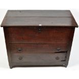 An 18th Century oak mule chest, the hinged top above two long drawers fitted ring handles,