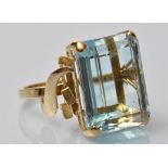 An aquamarine ring, of facet rectangular cut weighing approximately 22.00 carats, on modern 18ct.