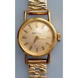 Omega: a lady's 18K gold cased wristwatch, circular baton dial, 9ct.