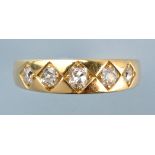 A five stone diamond ring, the old cut graduated diamonds in diamond-shaped mounts,