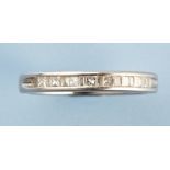 A diamond half hoop eternity ring, set with princess and baguette cut diamonds on platinum shank,
