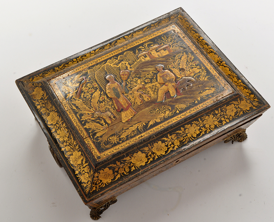 A 19th Century lacquer and gilt sarcophagus form games box,