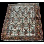 An Abadeh rug, with vases of flowers on white ground, 153 x 110cms (60 x 43in.).