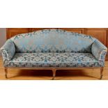 A 19th Century French style settee, the shaped back,