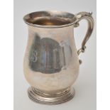 A Victorian mug, by Josiah Williams & Co., Exeter 1879, baluster shaped, engraved initials, 14cms.