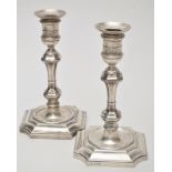 A matched pair of Victorian candlesticks, marker's marks rubbed, Sheffield 1896 and London 1897,