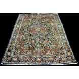 A Tabriz carpet, with a central medallion decorated with deer, birds featuring throughout,