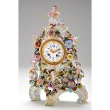 An ornate late 19th Century porcelain mantel clock, possibly Meissen,