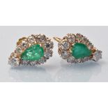 A pair of emerald and diamond earrings, of pear-shaped cluster form,