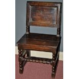 A 17th/18th Century oak hall chair,