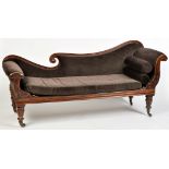 A Regency rosewood chaise longue, the shaped back,