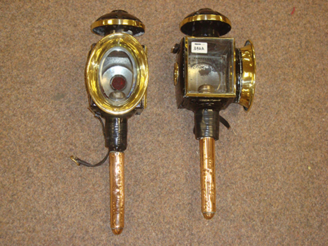 A pair of late 19th/early 20th Century copper, brass and black painted carriage lanterns.