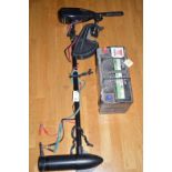 A Daiwa Model 36T electric battery operated outboard motor, motor instructions; and a battery.