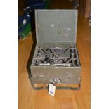 A khaki green painted military camping stove, with brass label with military arrow stamp.