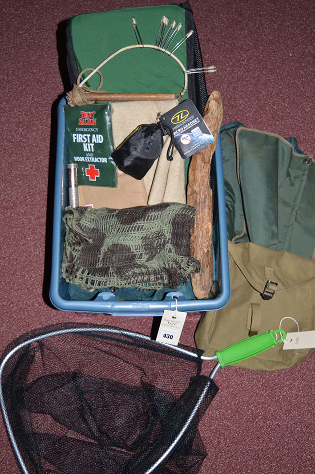 A collection of fishing bags; pouches; etc., in a box; including: a small landing net.