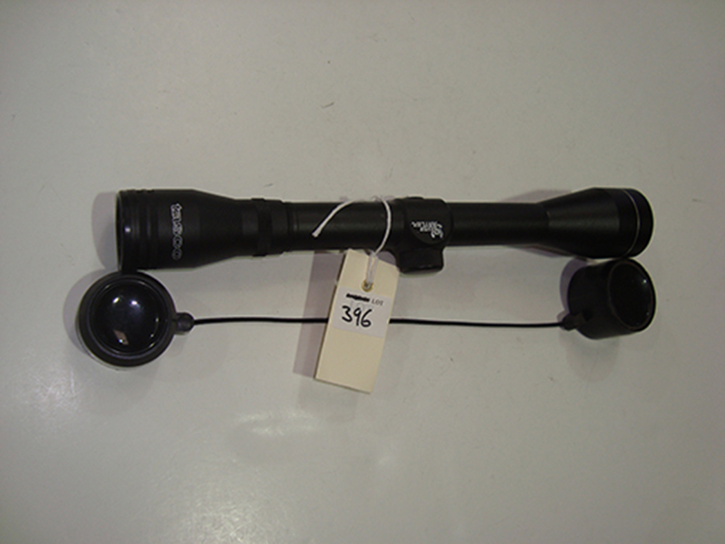 A silver antler Tasco scope.