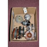 Two old mahogany fishing reels; a Basche Brown Spinster spinning reel; a large Paramount fly reel;