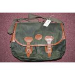 Tackle bag in green waxed canvas and leather trim, by J.