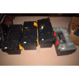 Four plastic tool boxes, some containing modelling equipment.