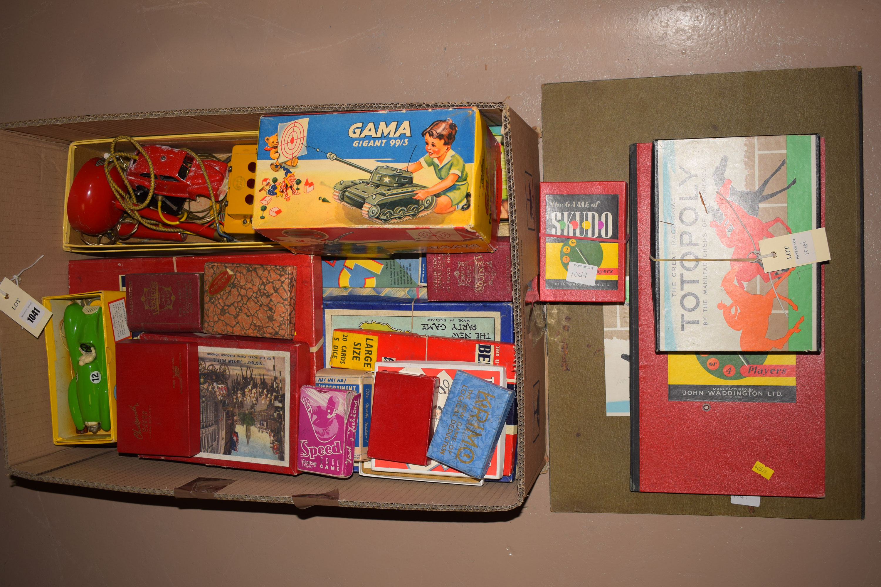 A collection of toys, games and puzzles, including: a Gamma Gigant 99/3 tinplate toy tank,