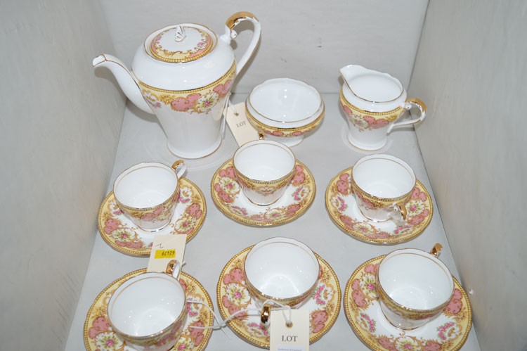 An Aynsley coffee service with floral band decoration, comprising: coffee pot, sugar and cream jug,