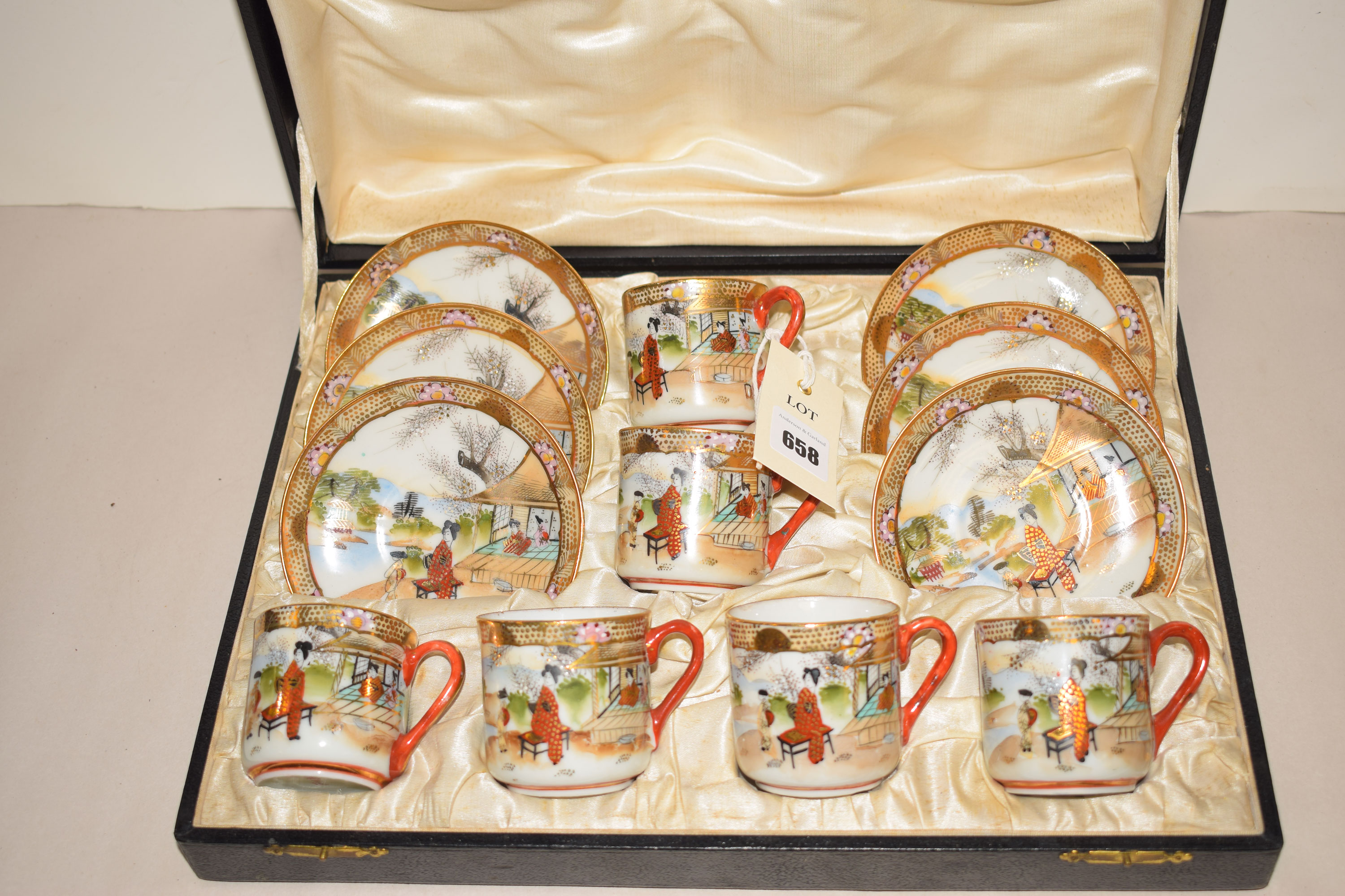 A Japanese tea set for six, comprising teacups and saucers, in fitted case.