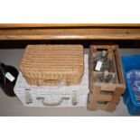 A wicker picnic case; together with another wicker case; and three glass demijohns.