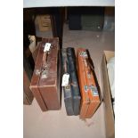 Three leather Masonic cases, each containing Masonic Regalia.