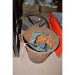 Various items, to include; a metal bucket; tow metal shoe lasts; a wheelbarrow wheel; and griddle.