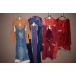 Theatre costumes, to include; Medieval style capes; coats; and a dress.