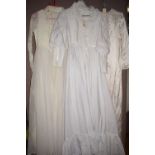 Three wedding dresses of various styles, one with Empire line.