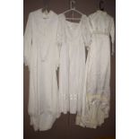 Three wedding dresses of various styles one with flared sleeves.