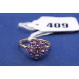 A pink sapphire and diamond ring, on 9ct. yellow gold shank, ring size R.