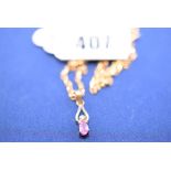 A pink sapphire and diamond pendant, in 9ct. yellow gold mount, on chain.