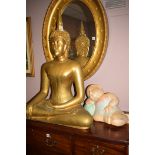 A modern carved statue of Buddha;