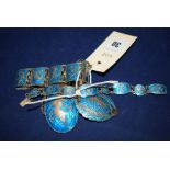 A silver and blue enamel suite of matching Siamese jewellery,