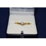 A diamond solitaire ring on 9ct. yellow gold shank, ring size N, 2.8grms.