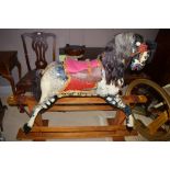 An early 20th Century piebald rocking horse, horse hair mane and tail, possibly by Collinson.