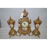 A 20th Century Continental clock garniture,