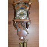 A Dutch style wall clock, roman dial in mahogany case.