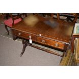 A reproduction inlaid mahogany sofa table, fitted two frieze drawers and two dummy drawers,